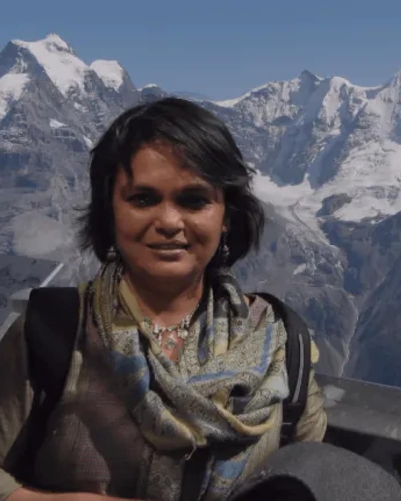 Sumitra Senapaty, founder of WOW Club, in front of snow-capped mountains