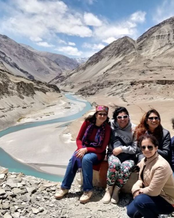 WOW Club travellers by a river in the mountains of Ladakh