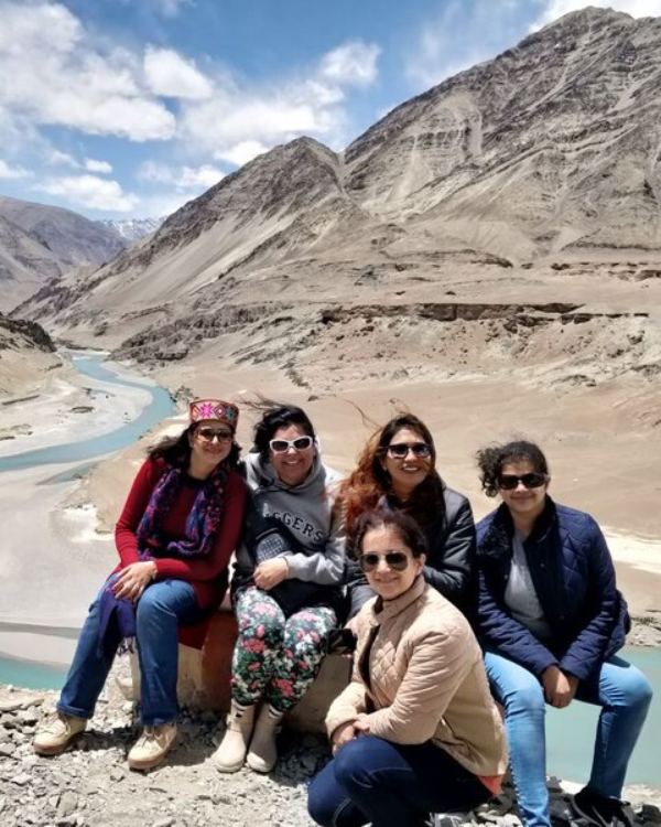 WOW Club travellers by a river in the mountains of Ladakh